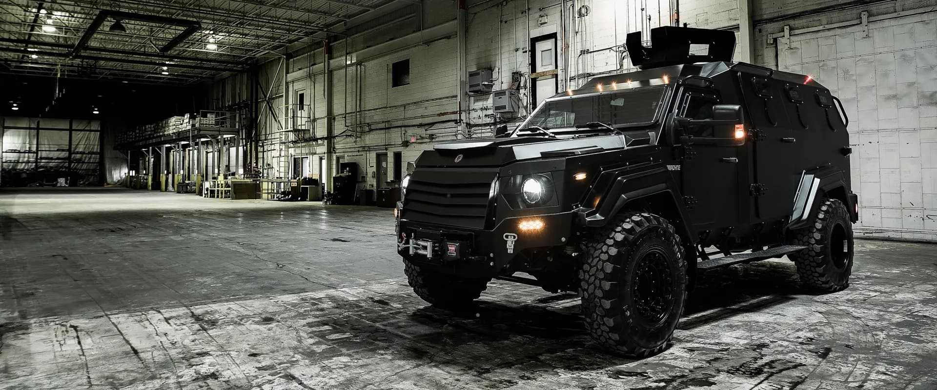 Armored vehicle in industrial warehouse